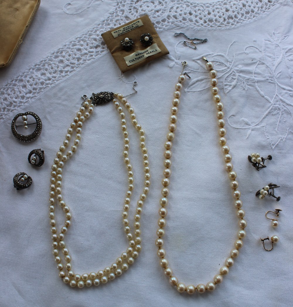 A pearl necklace comprising fifty two regular pearls to a white metal clasp, approximately 45cm, - Image 2 of 2