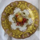 A set of three Royal Worcester porcelain cabinet plates painted with peaches and gooseberries by