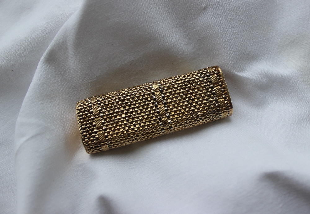 An 18ct yellow gold Cartier lighter, with a basket weave body, the base marked No.35859T, 6.