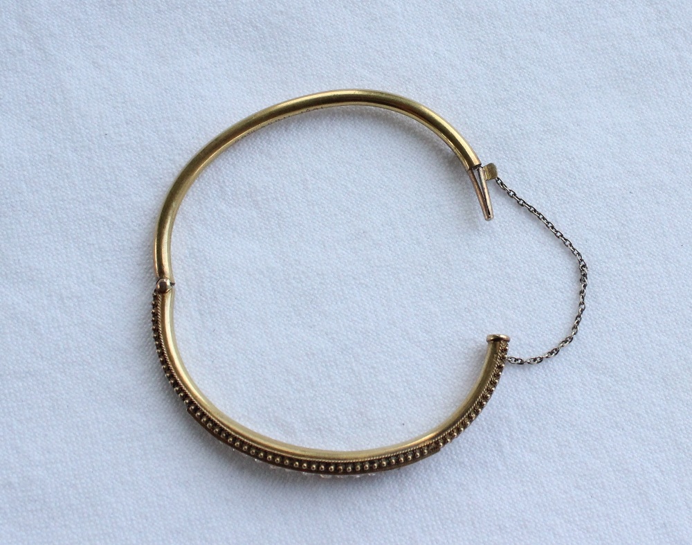 A Victorian diamond set hinged bangle set with thirteen round old cut diamonds to a yellow metal - Image 3 of 4