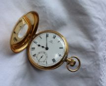 An 18ct yellow gold Omega keyless wound half hunter pocket watch, with an enamel dial,