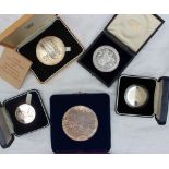 A silver medallion produced by the Royal Mint in celebration of the 25th Anniversary of the