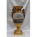 A continental porcelain twin handled vase, with a gilt flared rim, with winged terminal handles,