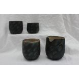 Studio pottery by Barbara Ineson - A pottery vase with a black ground decorated in blues and greens,