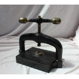 A Victorian cast iron book press with bronze ball handles,