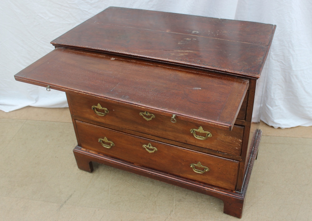 A George III style mahogany chest the rectangular planked top above a brushing slide and three - Image 3 of 6