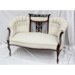 An Edwardian mahogany two seater settee,