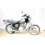 A Suzuki GN125Y petrol 124cc motorcycle in black, first registered 12-07-2002, Sorn,