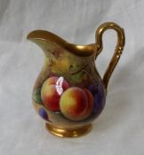 A Royal Worcester porcelain jug painted with peaches and black grapes to a naturalistic background,