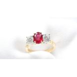 A ruby and diamond ring, the central oval mixed cut strong red transparent natural ruby 7.55mm x 5.