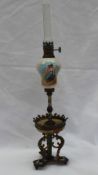 A miniature champleve enamel decorated oil lamp,