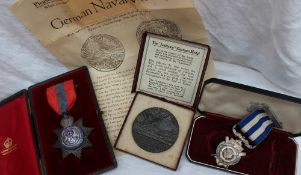 An Edward VII white metal on copper imperial service medal with blue enamel decoration,