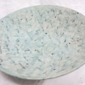 Studio pottery by Barbara Ineson - A large pottery bowl with green swirling decoration,