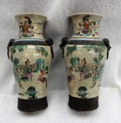A pair of Chinese crackle glaze vases with dog of foo mask handles,