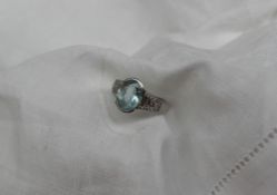 An 18ct white gold aquamarine and diamond dress ring,