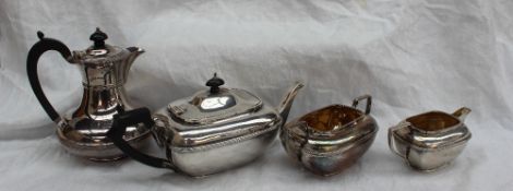 An Edward VII silver three piece tea set of flattened rectangular form, Birmingham, 1906,