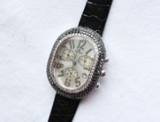 A Lady's Domoskenos wristwatch, the oval dial with Arabic numerals, and three subsidiary dials,