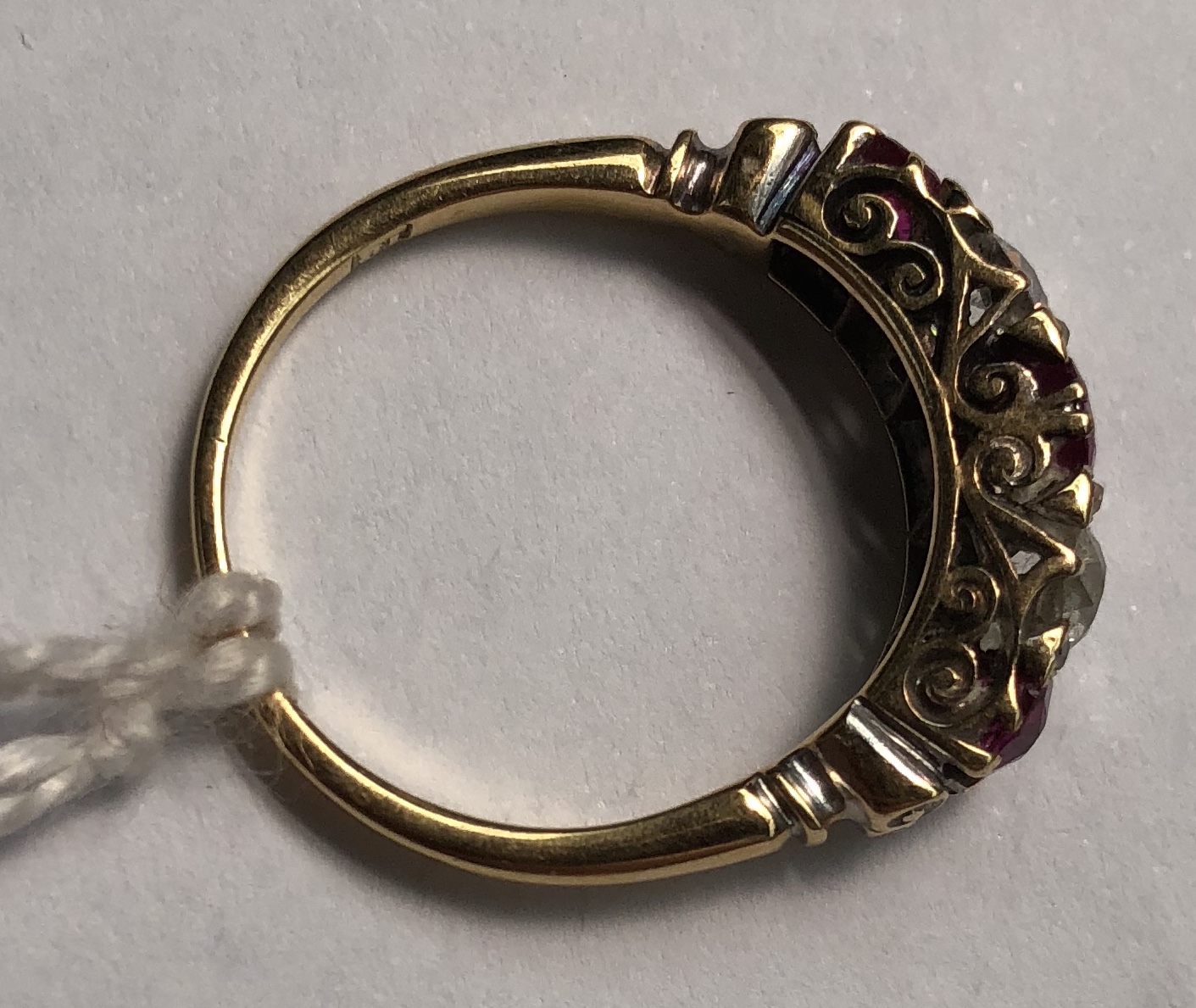 A ruby and diamond line ring, set with three rubies and two round old cut diamonds, - Bild 7 aus 9