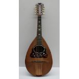 An Umberto Ceccherini bowl back mandolin, bears a trade label dated 1881,