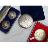 A silver medallion produced by the Royal Mint to commemorate the Silver Jubilee of Elizabeth II,