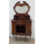 A 19th century mahogany chiffonier, the shield shaped upstand with a central mirror and shelf,