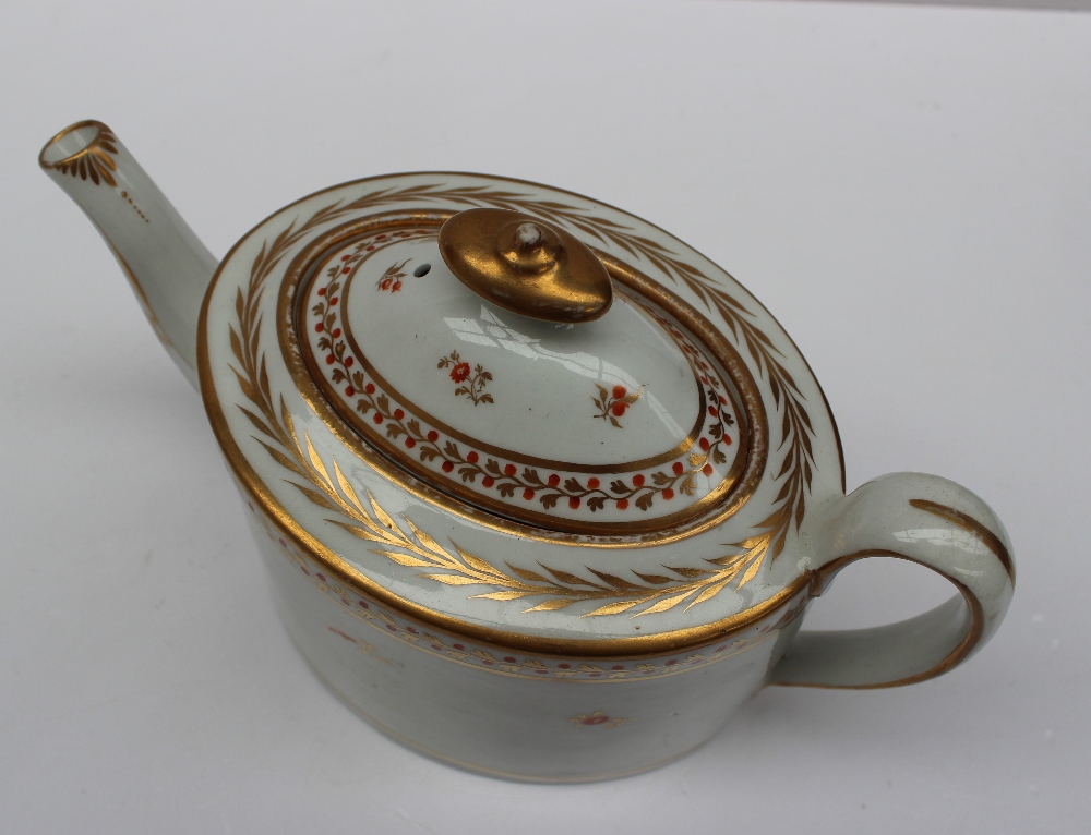 A 19th century porcelain teapot of oval form decorated with a floral band in gilt lines, - Image 2 of 5