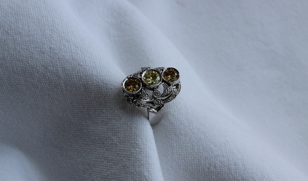 A diamond dress ring, set with three fancy yellow round brilliant cut diamonds, - Image 3 of 6