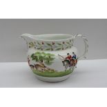 A 19th century pottery jug, with raised decoration of a Stag hunting scene, possibly New Hall,
