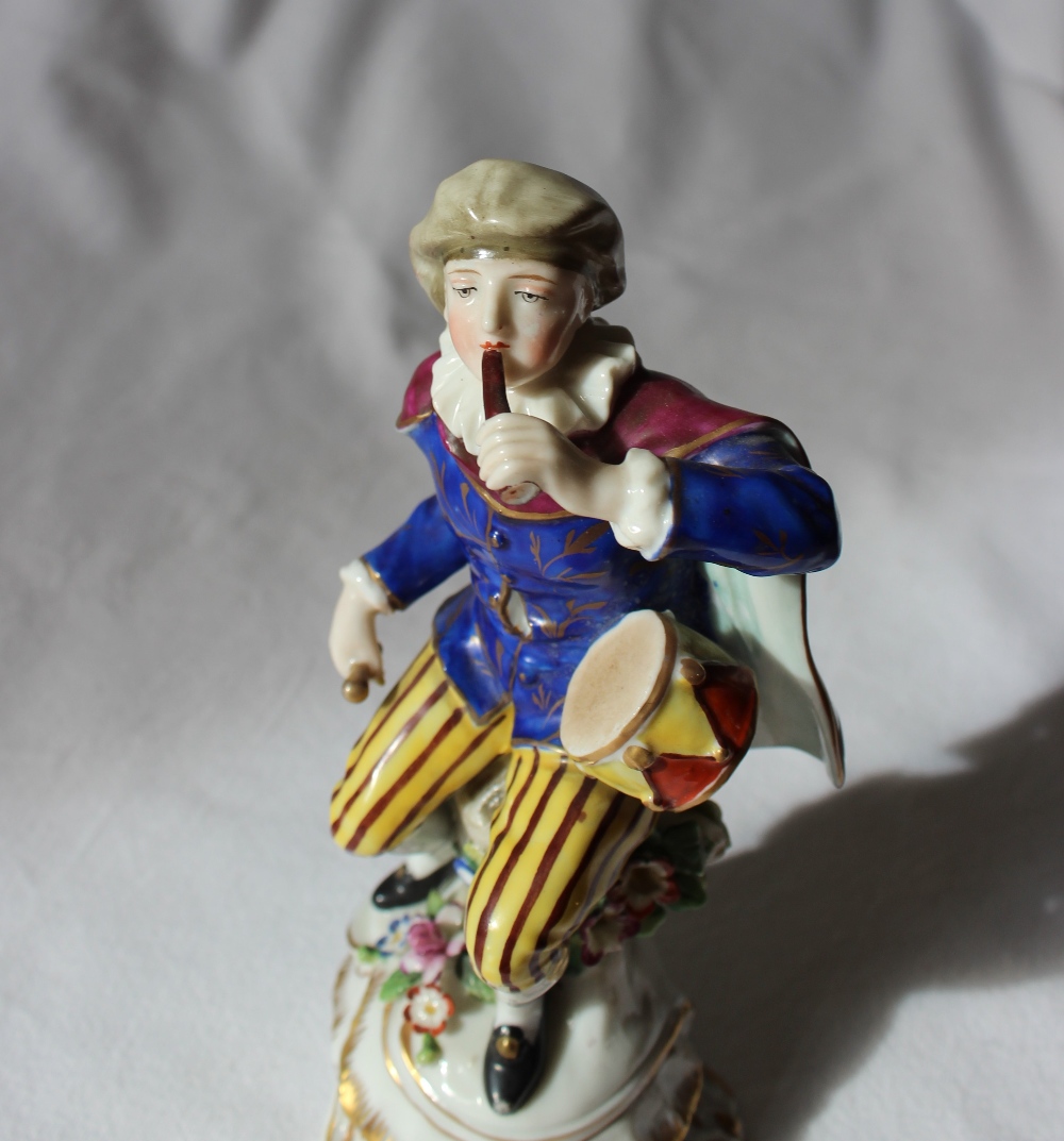 A 19th century porcelain seated figure, with a drum on his hip, in a gilt decorated blue tunic, - Image 3 of 5