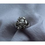 A diamond ring set with seven marquise shaped diamonds,