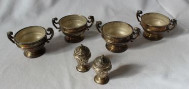 A set of four Edward VII silver twin handled pedestal open table salts, London, 1903,