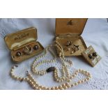 A pearl necklace comprising fifty two regular pearls to a white metal clasp, approximately 45cm,