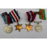 Four World War II medals, including the 1939-1945 Star, The France and Germany Star,