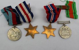 Four World War II medals, including the 1939-1945 Star, The France and Germany Star,