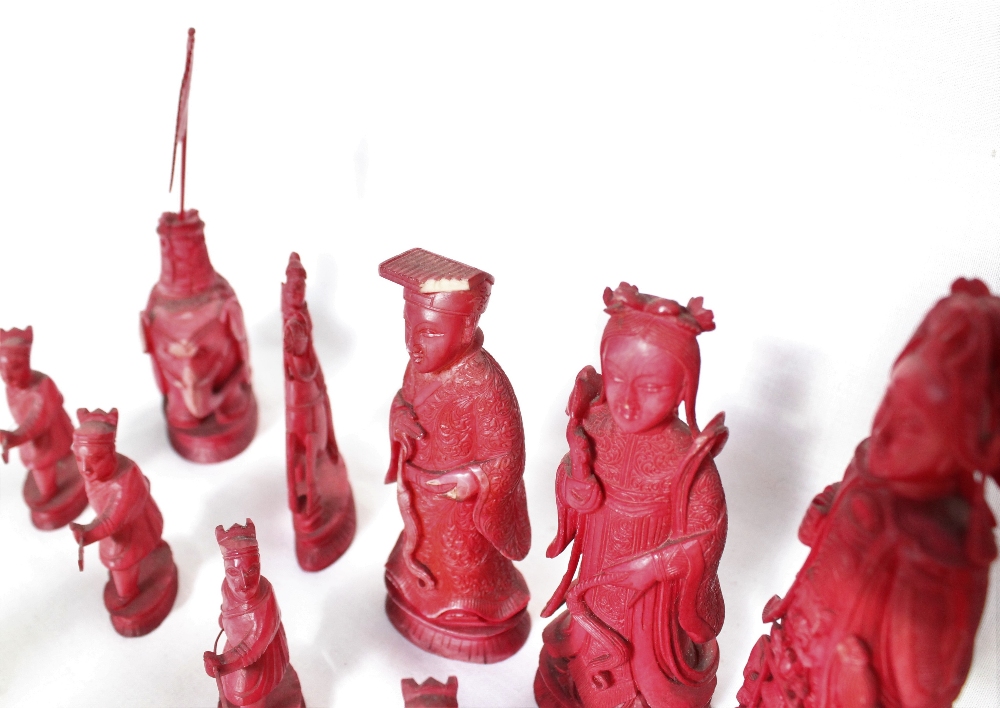 A 19th century Chinese carved ivory chess set, natural and stained red, - Image 3 of 8