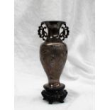 A Chinese silver baluster vase, with floral handles,