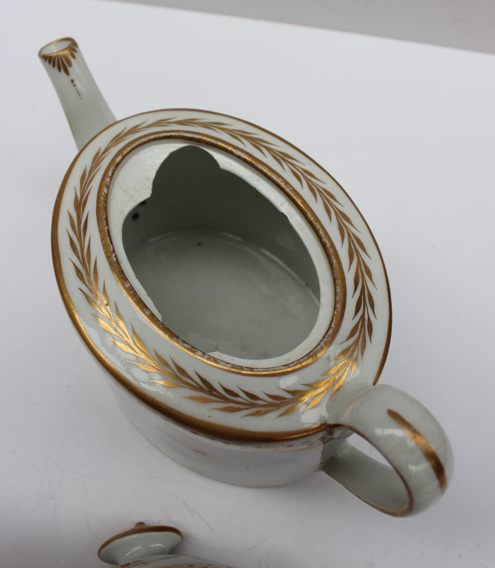 A 19th century porcelain teapot of oval form decorated with a floral band in gilt lines, - Image 3 of 5