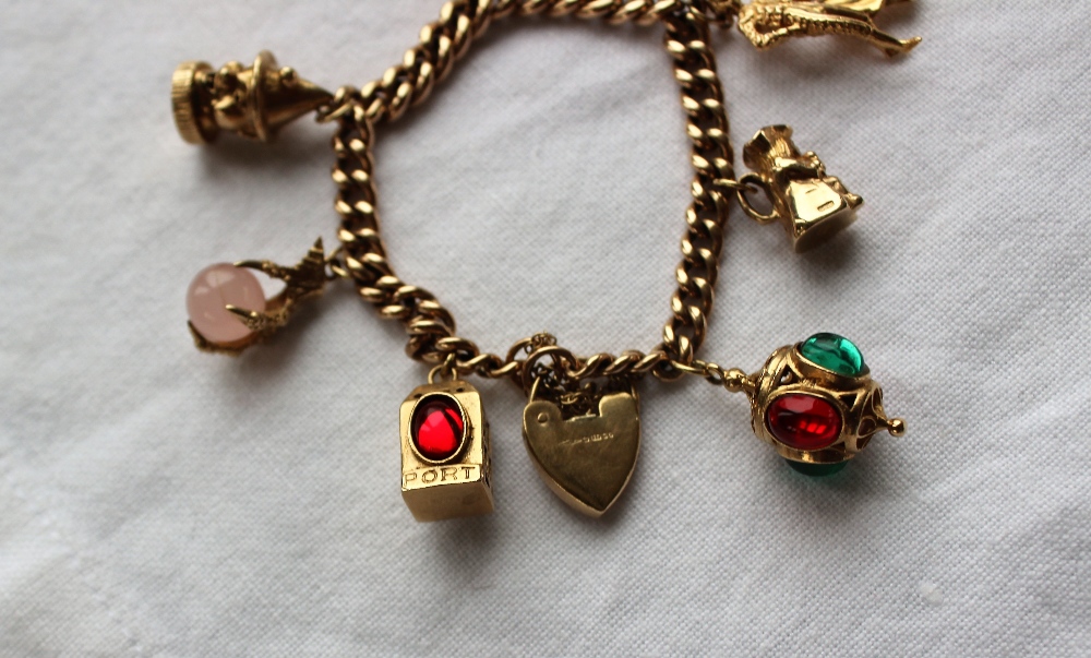 9ct yellow gold charm bracelet, set with numerous charms including a matador, toby jug, lanterns, - Bild 2 aus 3