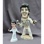 A John Hughes pottery Grogg of Elvis Presley, in white suit holding a microphone,