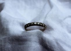 A ten stone diamond half eternity ring,