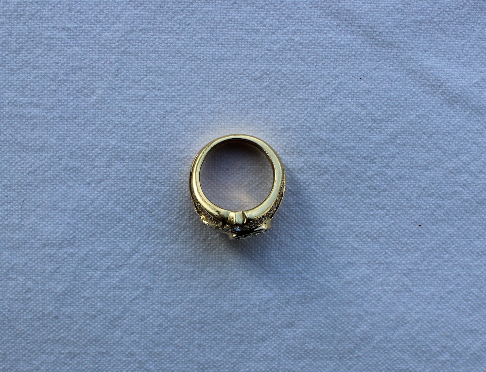 A sapphire and diamond ring, the central oval sapphire approximately 9mm x 6mm, - Image 4 of 9