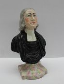 A Staffordshire bust of John Wesley, in ministerial clothes on a marbled socle base,