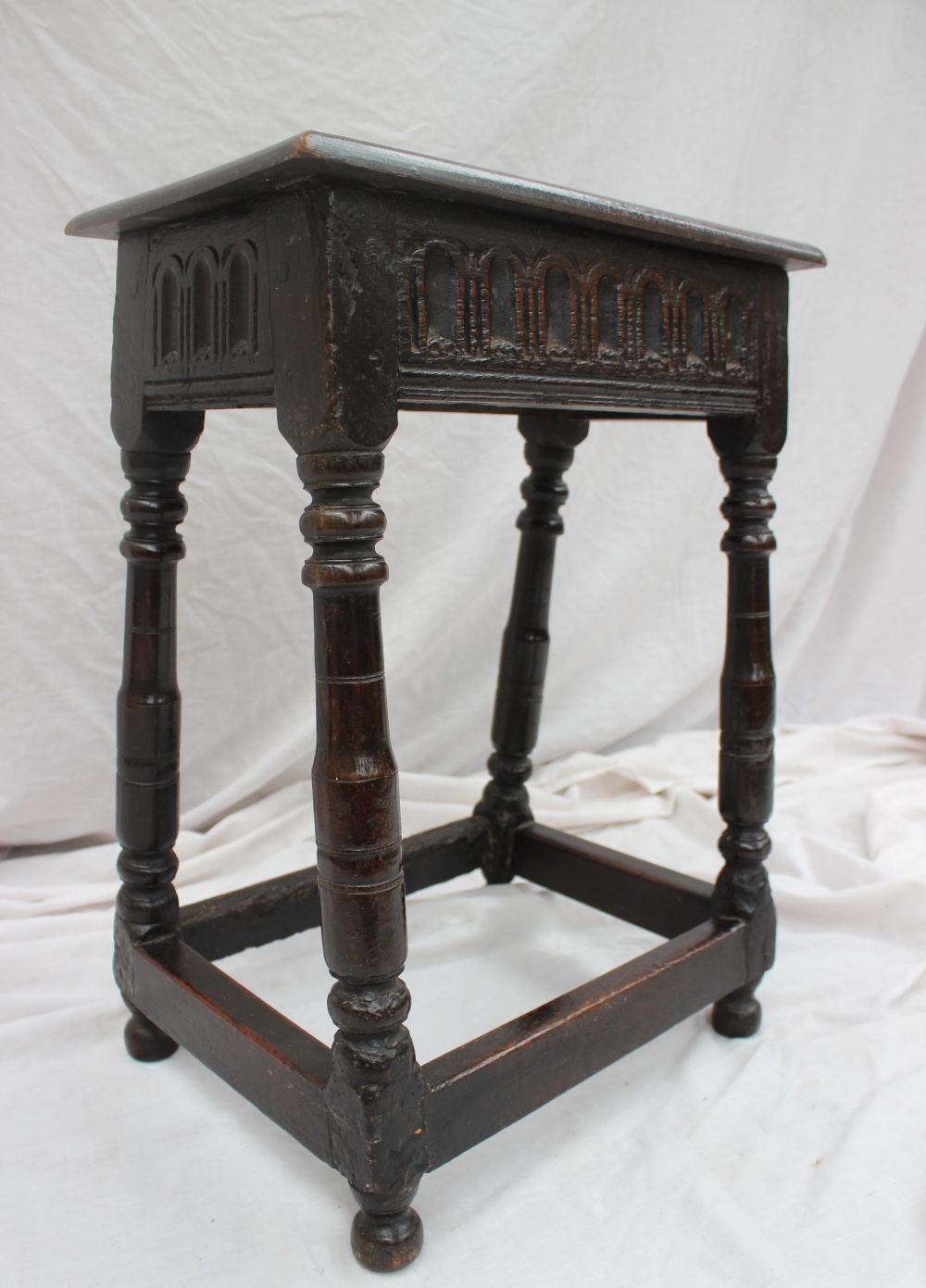 A 17th century and later oak 'Joynt' stool,