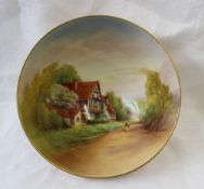 A Royal Worcester porcelain bowl of circular form on a circular foot,