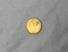 A Victorian gold shield back half Sovereign dated 1884