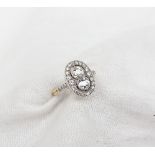 A diamond dress ring, set with two round old cut diamonds each approximately 0.