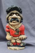 A John Hughes pottery Grogg of "Tail end Thomas", in a red Welsh jersey with the No.