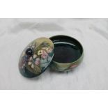 A Moorcroft pottery powder pot and cover,