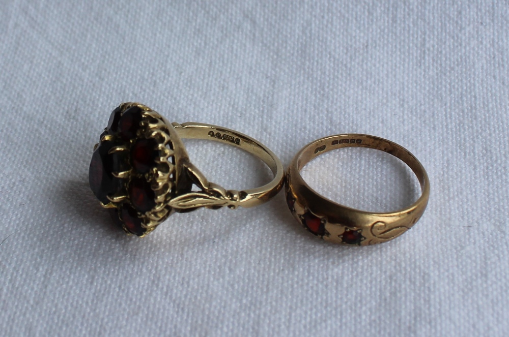 A 9ct yellow gold garnet set dress ring, set with a central oval garnet, - Image 3 of 3