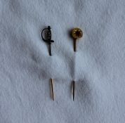 A diamond set sabre stick pin set with rose cut diamonds to a yellow metal shank together with